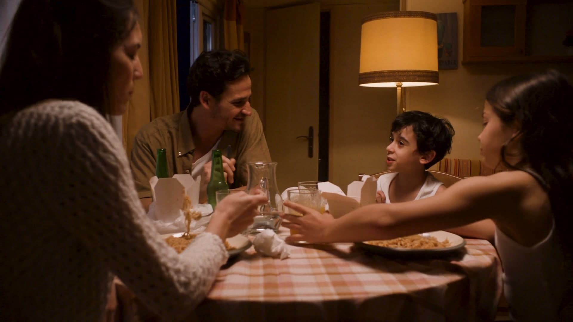 A family says grace before dinner